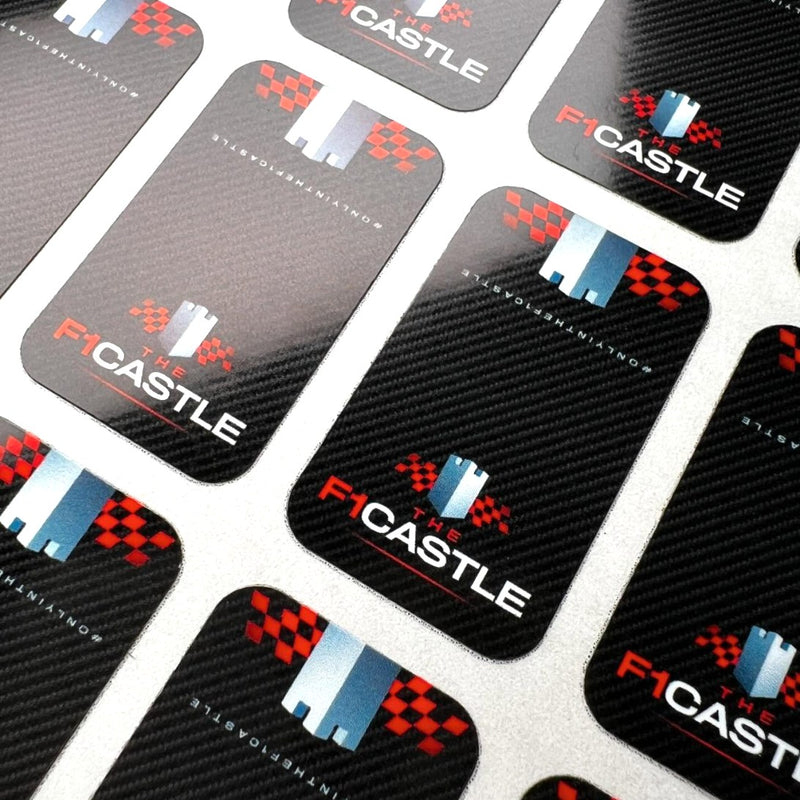 Sheet of custom black carbon-pattern Mag Seals with a red, white and blue logo